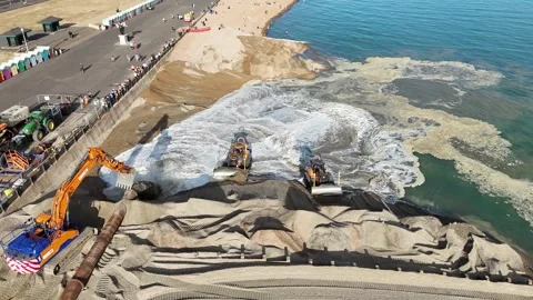 Marine construction builds a broader beach along Hove seafront Video stock 342643381