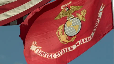 Marine Corp Flag and American Flag Waving in the Wind in Slow Motion Stock Footage