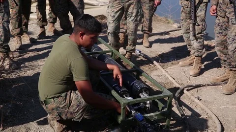 Marine demonstrating water purification system during crisis response exercise Vidéo 94566302