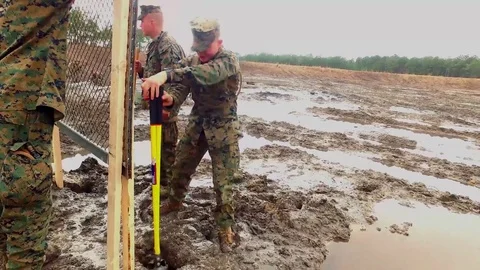 Marine digging hole for explosives 스톡 동영상 84969576