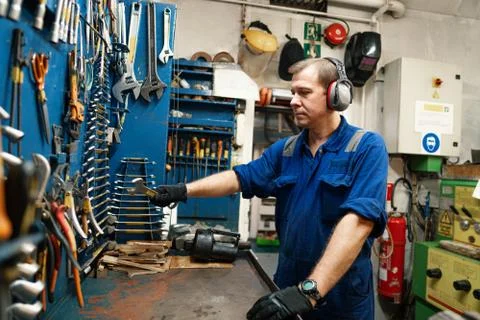 Marine engineer officer in engine control room ECR Stock Photos