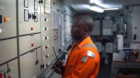 Marine engineer officer working in engine room Stock Footage 96485642