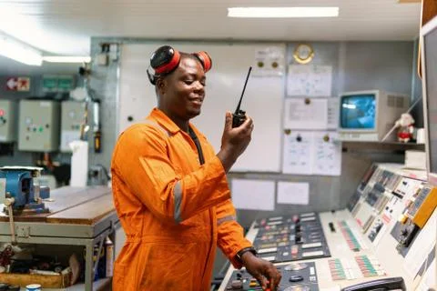 Marine engineer officer working in engine room Stock Photos