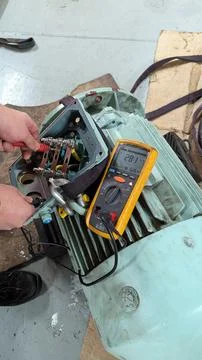 Marine Engineer Performing Megger Insulation Resistance Test on Electric Moto Stock Photos