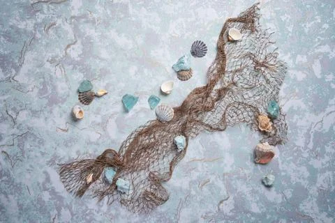 Marine Network and shells on blue boards, flat lay Stock Photos