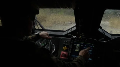 Marine operating onboard computer in new Oshkosh joint light tactical vehicle Stock Footage 104601075