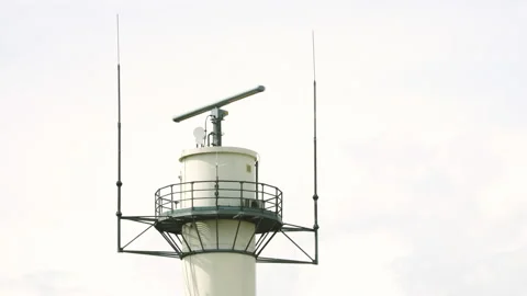 Marine radar rotating on a white tower. Stock Footage 201325812