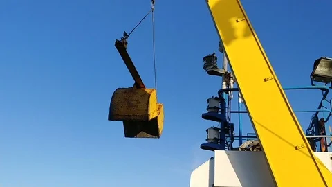 Marine Research: the bottom sampling device (Van Veen grab) is lowered into the Stock Footage 124518209