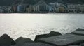 Marine rocks near town HD Footage