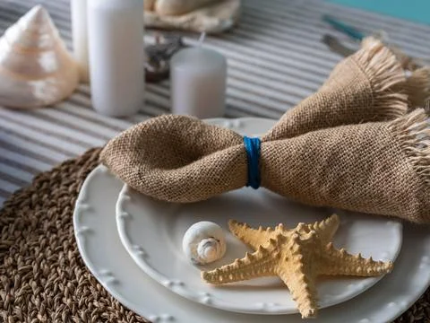 Marine style in the interior, table setting in a sea style Stock Photos