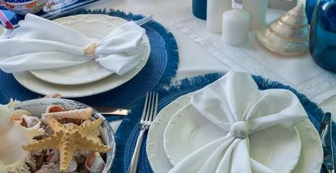Marine style in the interior, table setting in a sea style Stock Photos