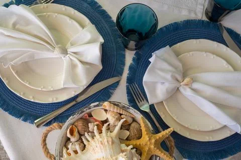 Marine style in the interior, table setting in a sea style Stock Photos