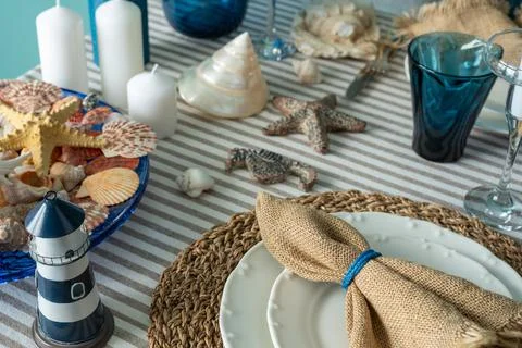 Marine style in the interior, table setting in a sea style Stock Photos