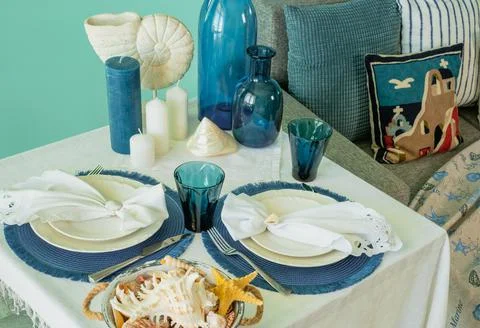 Marine style in the interior, table setting in a sea style Stock Photos
