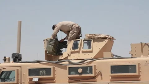 Marine Working on MAT-V(MRAP)Mine Resistant Vehicle (HD)c Stock Footage 7731382
