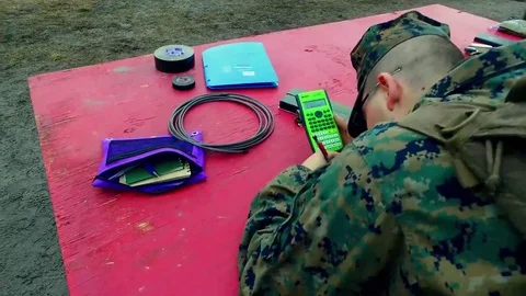 Marine writing in notebook during explosives and breaching Stock Footage 84969631