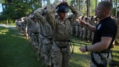 Marines in basic training compete in  various workout drills including Stock Footage 123375676