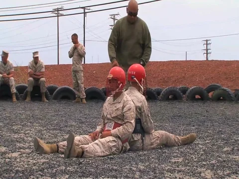 Marines in basic training learn hand to hand combat techniques using foam bats. Video stock 74808999