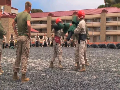 Marines in basic training learn hand to hand combat techniques using foam bats. Video stock 74811559