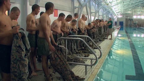 Marines in basic training learn swimming and aquatic rescue skills. Video stock 123369838
