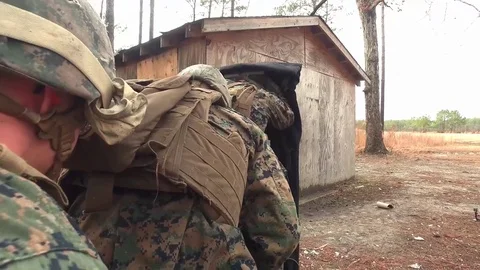 Marines blast door of building using explosives Stock Footage 84970648