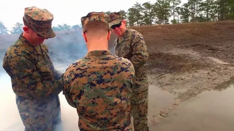 Marines drilling earth during explosives training Stock Footage 84969514