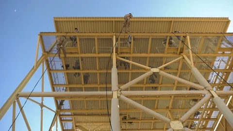 Marines fast roping from rappel tower during training at Camp Beuhring, Kuwait 動画素材 103201843