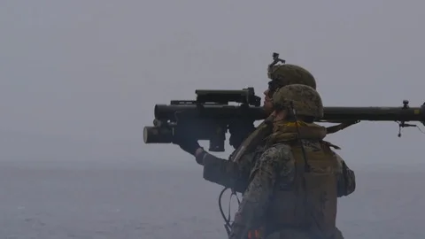 Marines fire Stinger missile from USS Iwo Jima Stock Footage 88083648