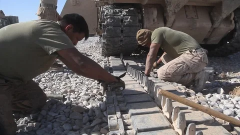 Marines replace the track on an M88A2 Hercules at Forward Operating Base - 2010 Stock Footage 107551257