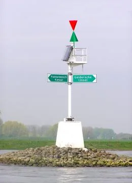 Maritime directing post in river Stock Photos