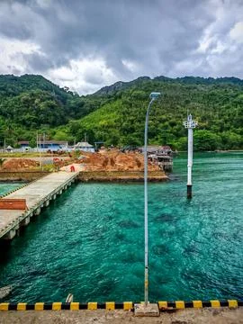 Maritime Infrastructure Development with Concrete Pier and Harbor Beacon Photos