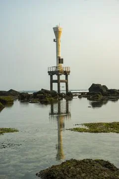 A maritime navigation light beacon at Pidakan beach. Stock-Fotos