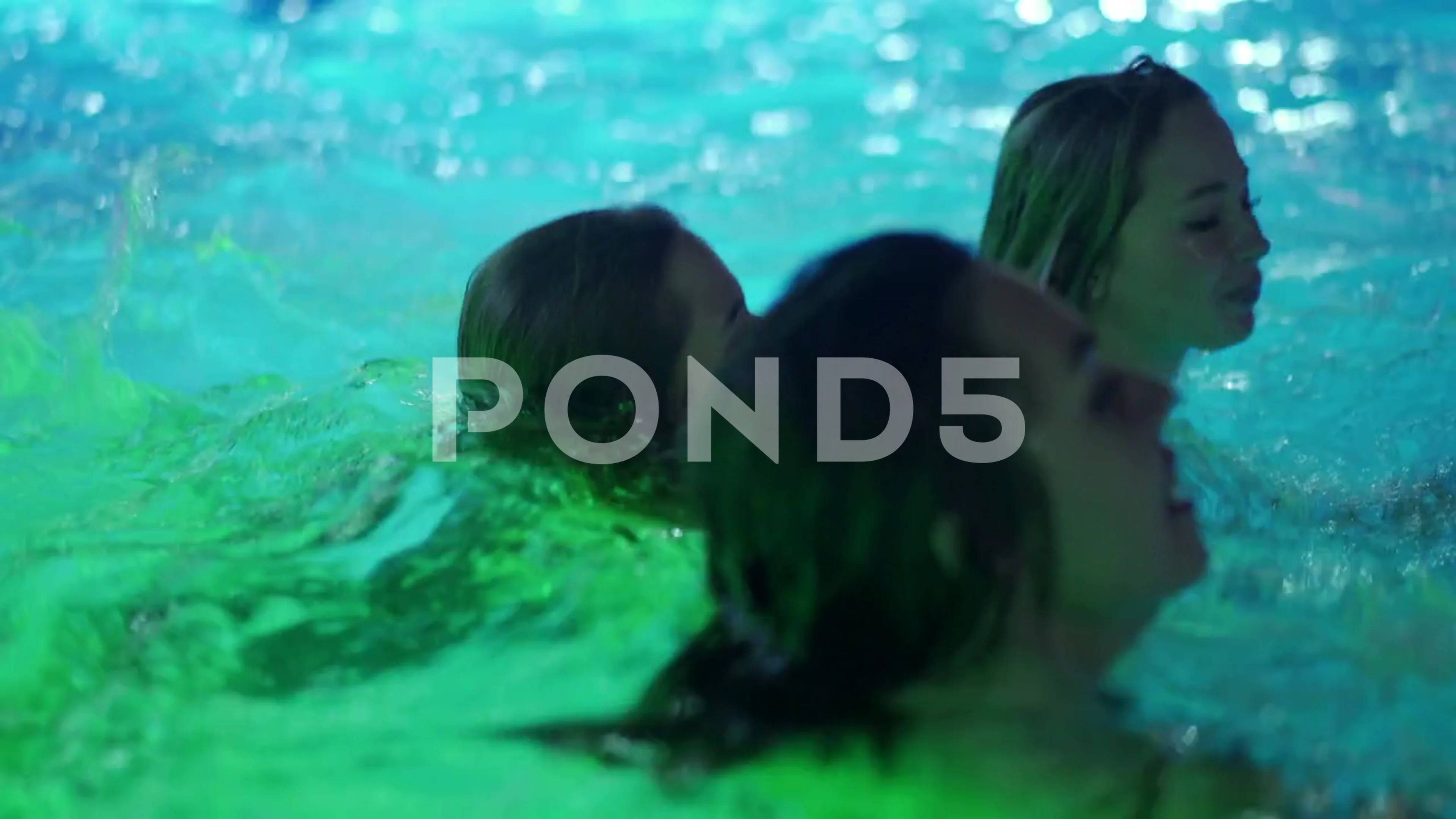 Mariupol, Ukraine - July 24, 2021. Girls have night pool party in a private