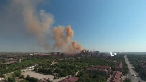 Mariupol, Ukraine - September 17, 2021: Aerial view. orange smoke comes out of Stock Footage