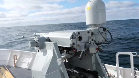 Mark 38 25mm machine gun system firing from U.S. Coast Guard Cutter Melvin Bell Stock Footage 266248614