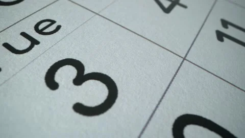 Mark the 3rd number on the calendar in macro shot.r. A black number 3. on Stock Footage 188454006