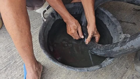 Mark the tires that need to be repaired and patched Stock Footage 252884612