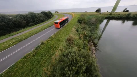Marken, 2nd of September 2021, The Netherlands. Passenger bus and car driving Stockbeeldmateriaal 160093567
