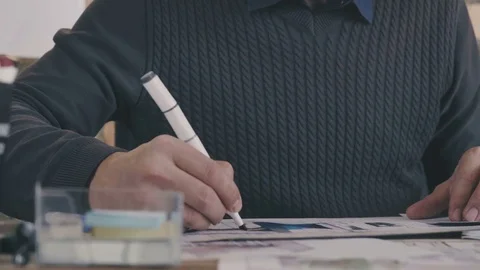 A marker in a man's hand, a portrait of an architect with a beard Stock Footage 73667765