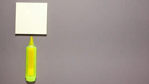 Marker, sticky note on gray with copy space on the left side Stock Footage 123808749