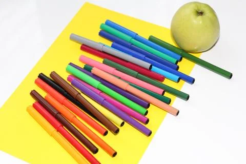 Markers are scattered on the table Stock Photos