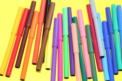 Markers are scattered on the table Stock Photos