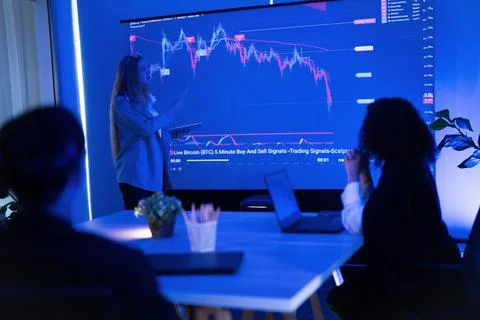 Market analysis session focused on Bitcoin trading strategies in a modern o.. Stock Photos