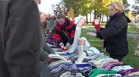 Market counter with different patterns homemade wool socks Stock Footage 36936906