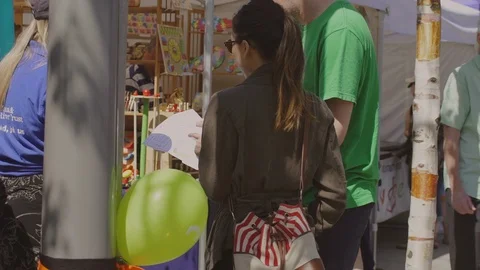 Market. Couple asking for information Stock Footage 93201937