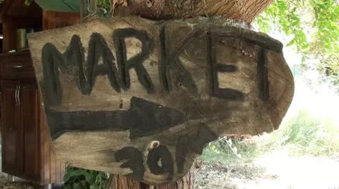 Market sign on a tree Stock Footage 12381489