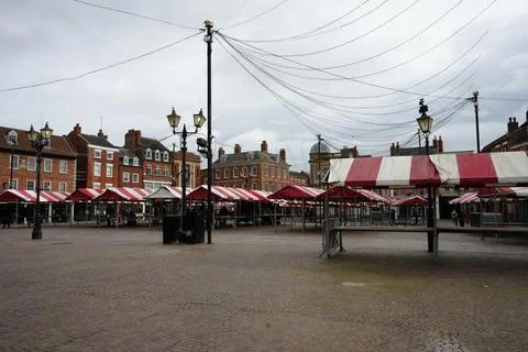 Market Square With Empty Red And White Stalls, Historic Buildings, Cloudy Sky, Stock Photos