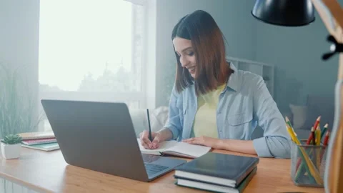 Marketer lady sit table use netbook write boss tips in comfort lockdown room Stock Footage 166216199