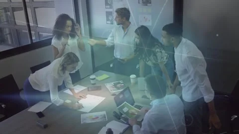 Marketers at table, moderator gesturing, sparking layout debate, marking Stock Footage 330936189