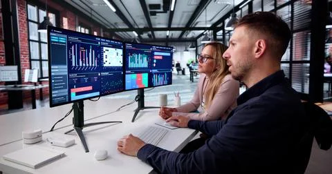 Marketing Manager Analyzing Performance Data On Panoramic Computer Screen Stock Photos